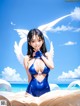 A woman in a blue bathing suit with white wings.